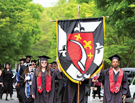 Group of students holding a banner. Link to Life Stage Gift Planner Under Age 60 Situations.