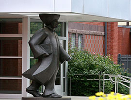 A statue as a column for a building. Links to Gifts That Protect Your Assets