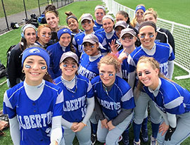 A girls softball team. Links to What to Give