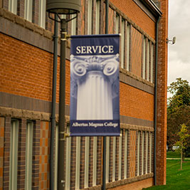 A banner on a pole. Links to Gifts by Will